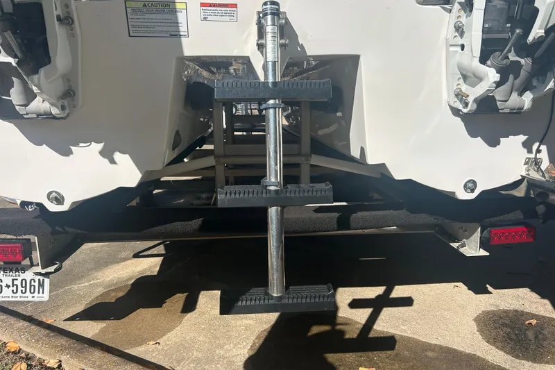 Slide: The Image of 2021 Twin Vee 260 VIVA boat stern with ladder and trailer details. - 36