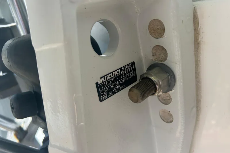 Slide: The Image of Close-up of a Suzuki motor part on a 2021 Twin Vee 260 VIVA boat. - 38