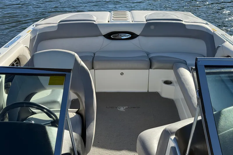 Slide: The Image of 2012 Centurion Enzo SV211 boat interior with gray seating and steering wheel. - 16