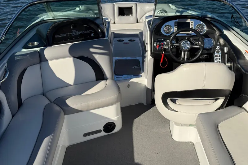 Slide: The Image of Interior of a 2012 Centurion Enzo SV211 boat with modern dashboard and seating. - 20