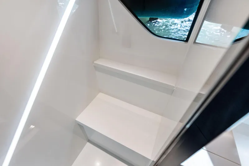 Slide: The Image of Interior stairs of 2021 Riva 56 Rivale yacht with sleek design and window view. - 60