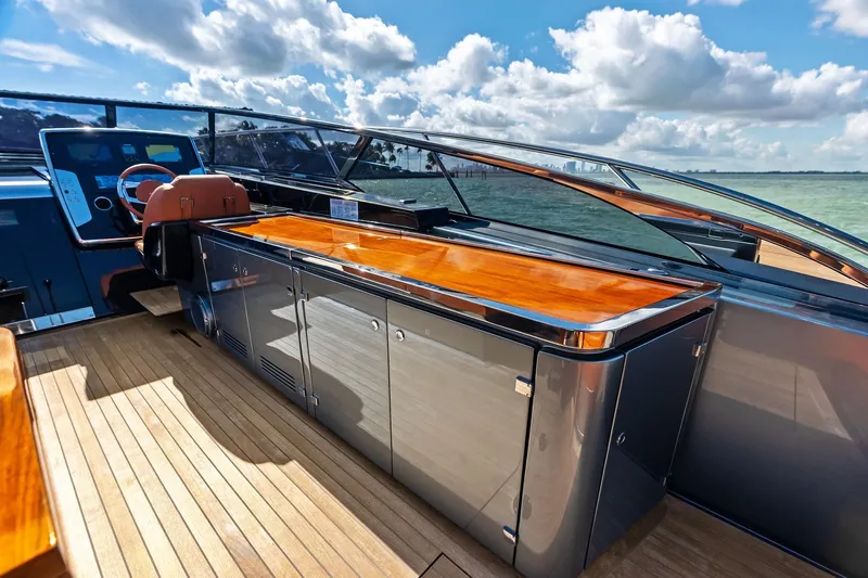 Slide: The Image of Luxurious 2021 Riva 56 Rivale yacht deck with sleek wood and metal finishes. - 35
