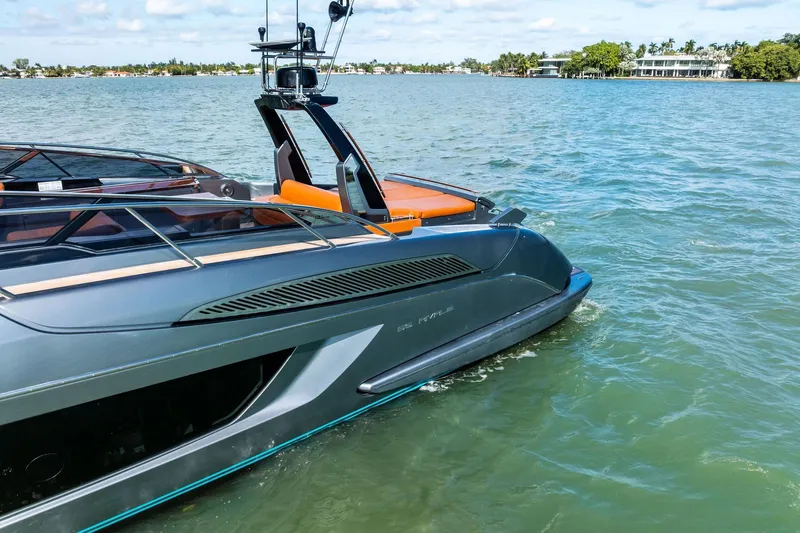 Slide: The Image of 2021 Riva 56 Rivale luxury yacht cruising on a sunny day. - 15