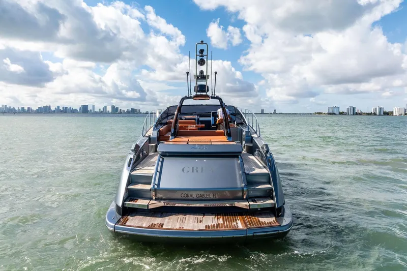 Slide: The Image of 2021 Riva 56 Rivale yacht on water with city skyline in background. - 11