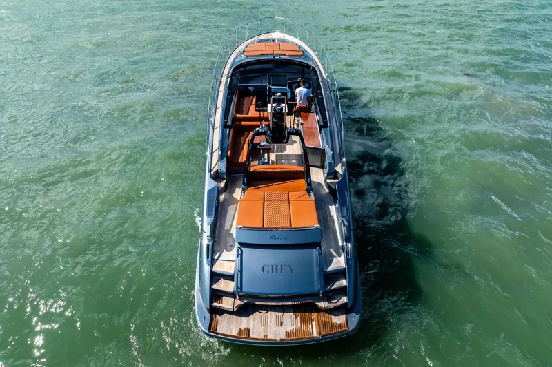 Slide: The Image of 2021 Riva 56 Rivale luxury yacht cruising on open water, aerial view. - 12