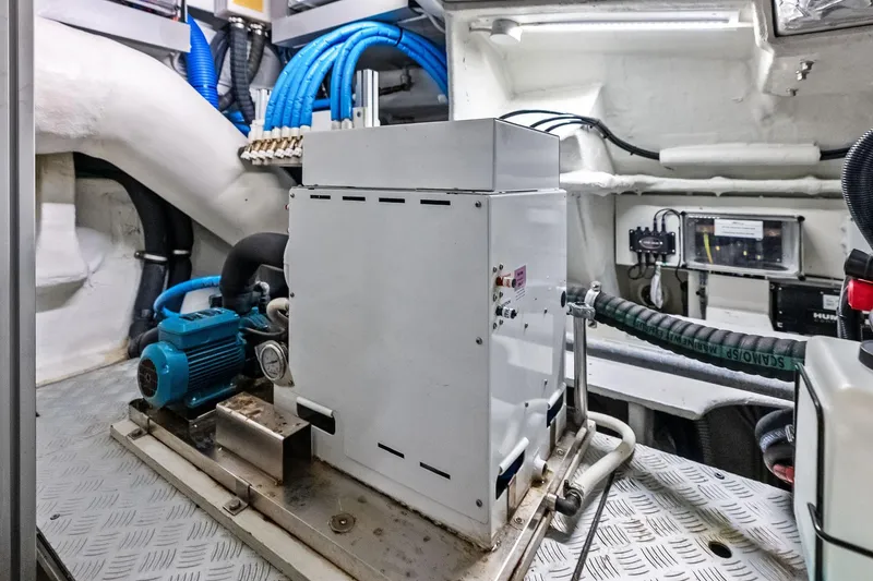 Slide: The Image of Engine room of 2021 Riva 56 RIVALE yacht with machinery and cables. - 68