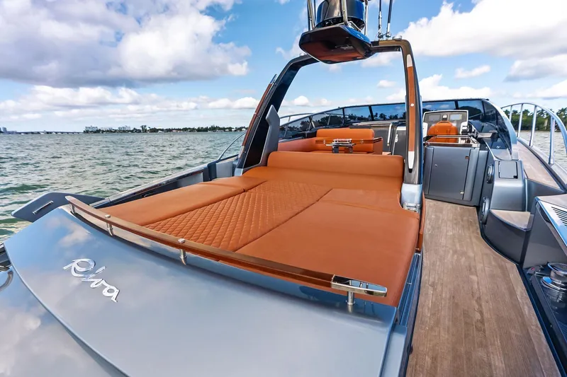 Slide: The Image of Luxurious 2021 Riva 56 Rivale yacht with elegant deck and plush seating on open water. - 20
