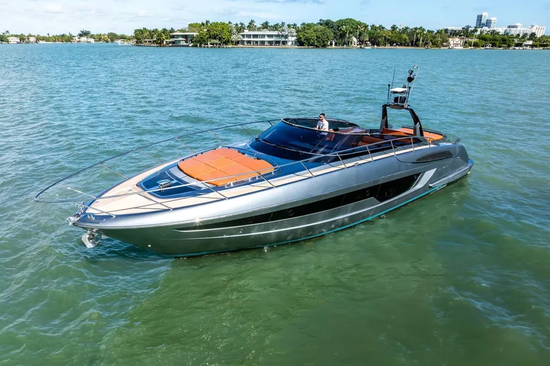Slide: The Image of Luxury 2021 Riva 56 Rivale yacht cruising on serene waters. - 9