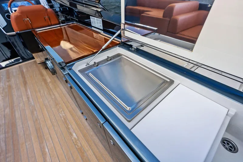 Slide: The Image of Luxury yacht Riva 56 RIVALE 2021 interior with sleek kitchen and wooden flooring. - 28