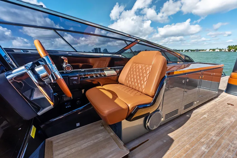 Slide: The Image of Luxurious 2021 Riva 56 Rivale yacht interior with leather seating and sleek dashboard. - 34