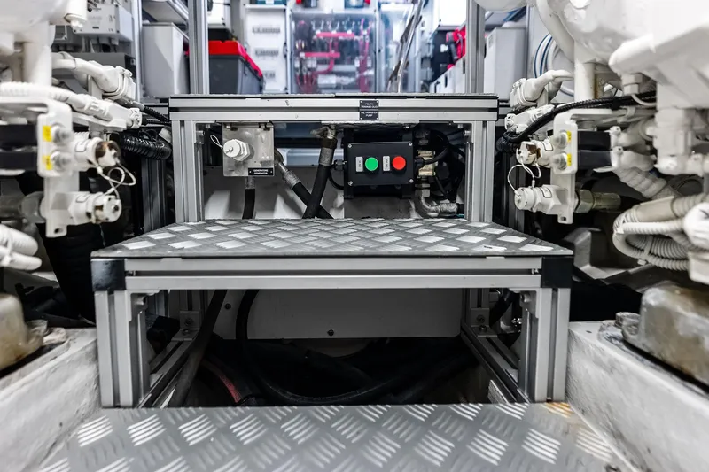 Slide: The Image of Engine room of 2021 Riva 56 Rivale yacht, showcasing mechanical components and control systems. - 71