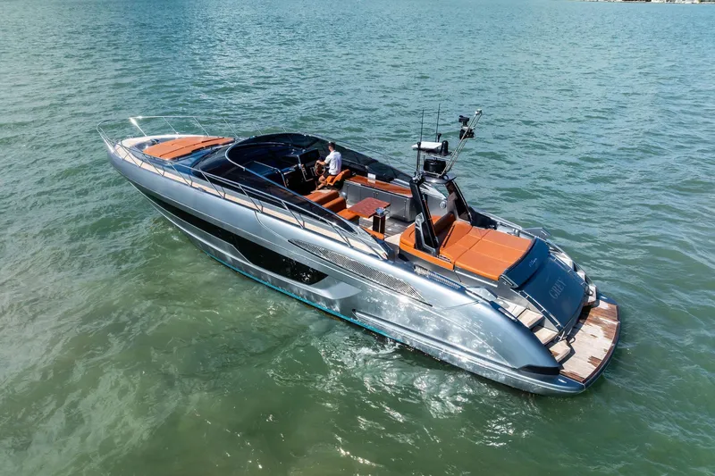 Slide: The Image of 2021 Riva 56 Rivale luxury yacht cruising on open water. - 10