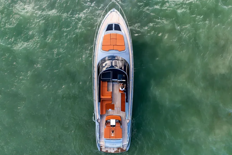 Slide: The Image of Aerial view of 2021 Riva 56 Rivale yacht on green water. - 13