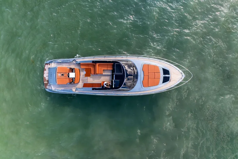 Slide: The Image of Aerial view of 2021 Riva 56 Rivale yacht on green water. - 14