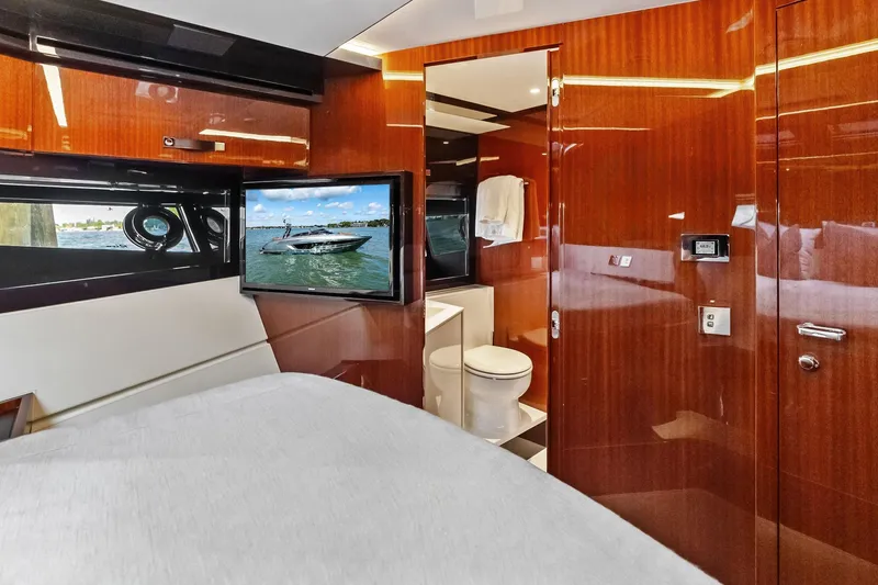 Slide: The Image of Luxurious interior of 2021 Riva 56 Rivale yacht with wood paneling and modern amenities. - 49