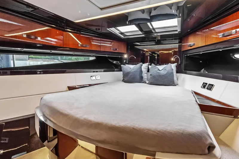 Slide: The Image of Luxurious interior of 2021 Riva 56 Rivale yacht with elegant bedding and wood finishes. - 48