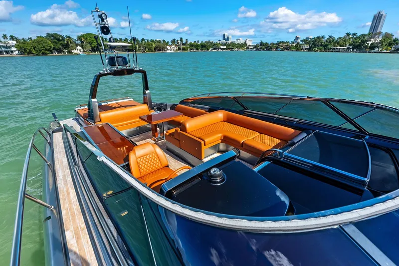 Slide: The Image of Luxurious 2021 Riva 56 Rivale yacht with elegant seating on a sunny day. - 17