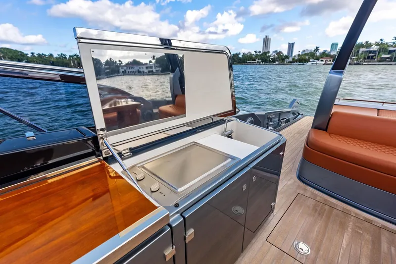 Slide: The Image of Luxury 2021 Riva 56 Rivale yacht with outdoor sink and seating area. - 26