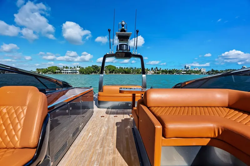 Slide: The Image of Luxurious 2021 Riva 56 Rivale yacht with elegant leather seating and scenic ocean view. - 24