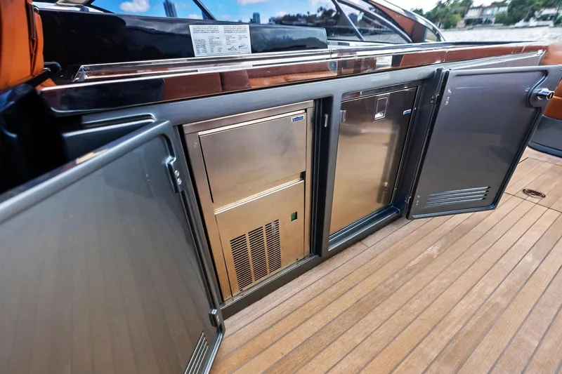 Slide: The Image of Open storage compartments on 2021 Riva 56 Rivale yacht deck, showcasing sleek design. - 31