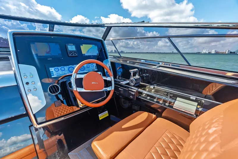 Slide: The Image of Luxurious 2021 Riva 56 RIVALE yacht cockpit with leather seating and advanced navigation controls. - 33