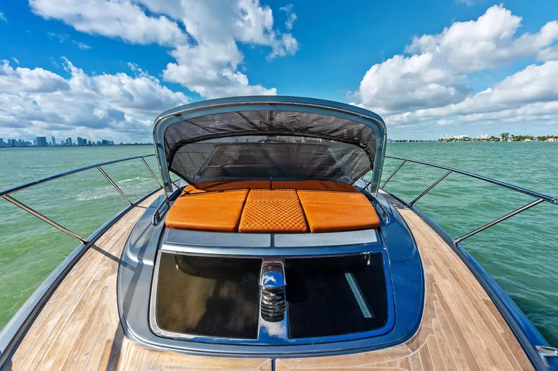 Slide: The Image of 2021 Riva 56 Rivale yacht on open water, featuring sleek design and luxurious sunbathing area. - 37