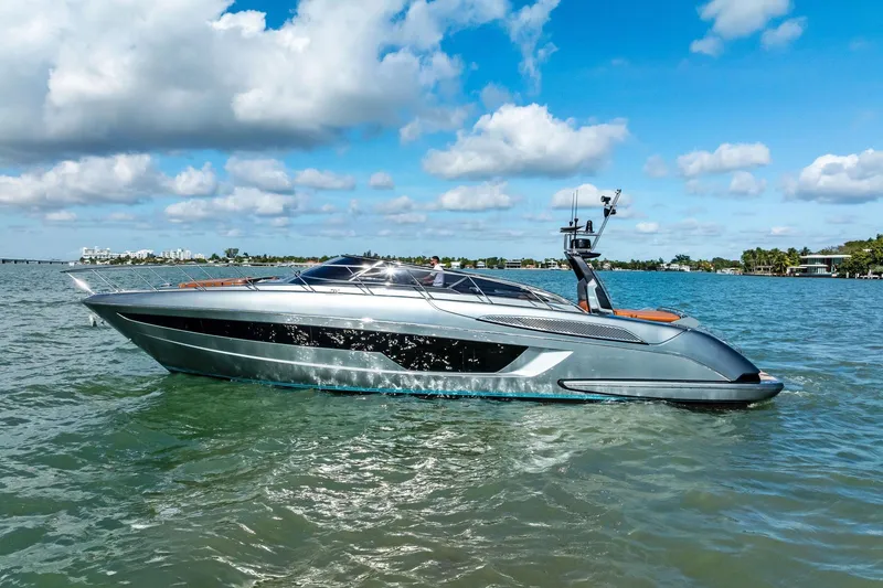 Slide: The Image of 2021 Riva 56 Rivale yacht cruising on a sunny day with blue skies and calm waters. - 7