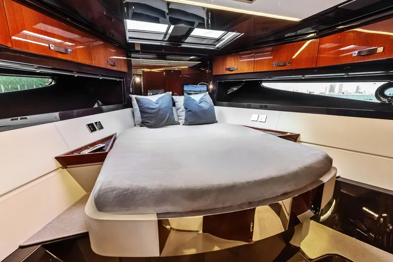 Slide: The Image of Luxurious interior of 2021 Riva 56 Rivale yacht with elegant wood finishes and cozy bedding. - 47
