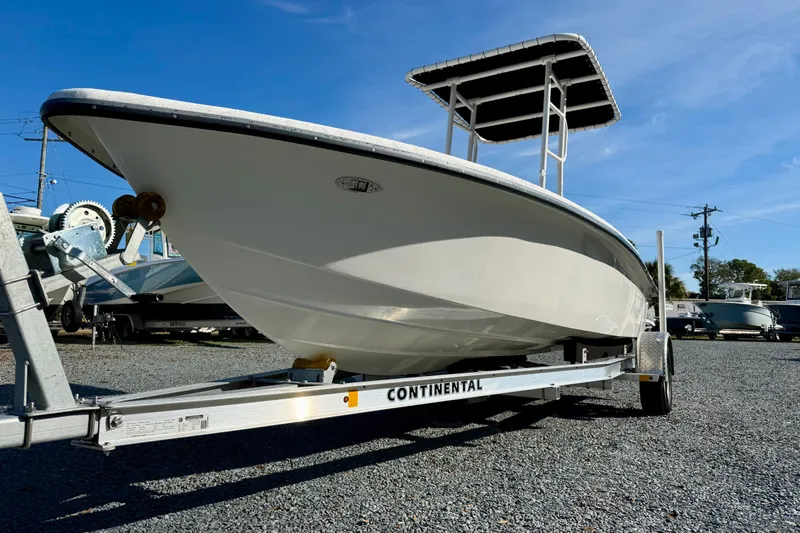 Slide: The Image of 2023 Rabco R21 boat on Continental trailer under clear blue sky. - 10