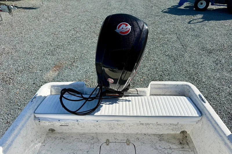 Slide: The Image of 2023 Rabco R21 boat with outboard motor on gravel surface. - 13