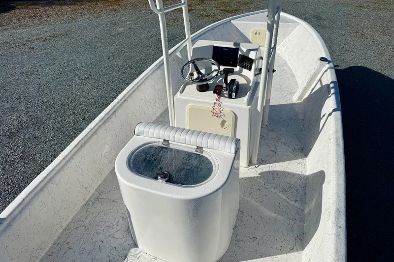 Slide: The Image of 2023 Rabco R21 boat interior with steering console and seating. - 15