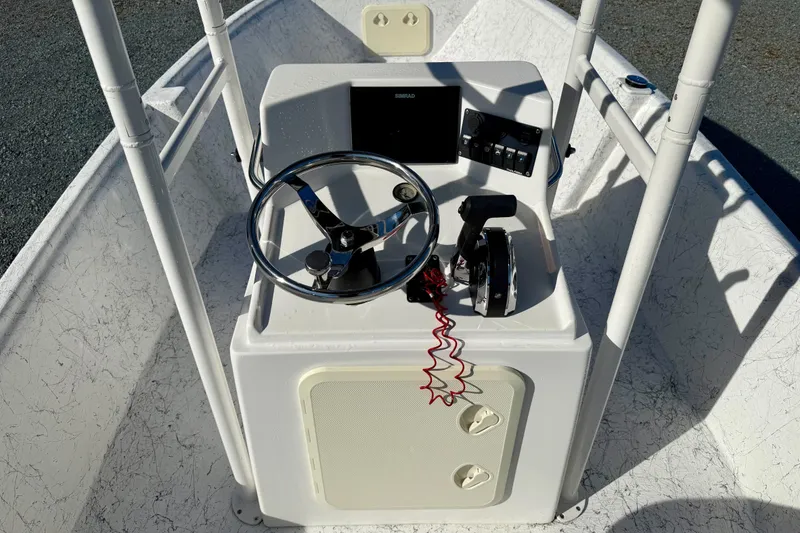 Slide: The Image of 2023 Rabco R21 boat console with steering wheel and control panel. - 17