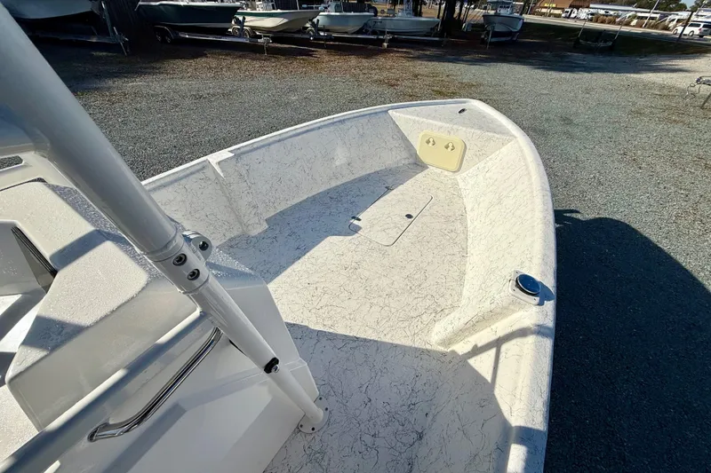 Slide: The Image of 2023 Rabco R21 boat deck, white textured surface, parked outdoors. - 19