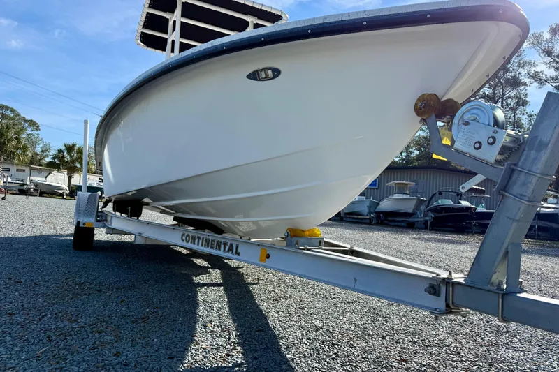 Slide: The Image of 2023 Rabco R21 boat on Continental trailer in outdoor storage area. - 9