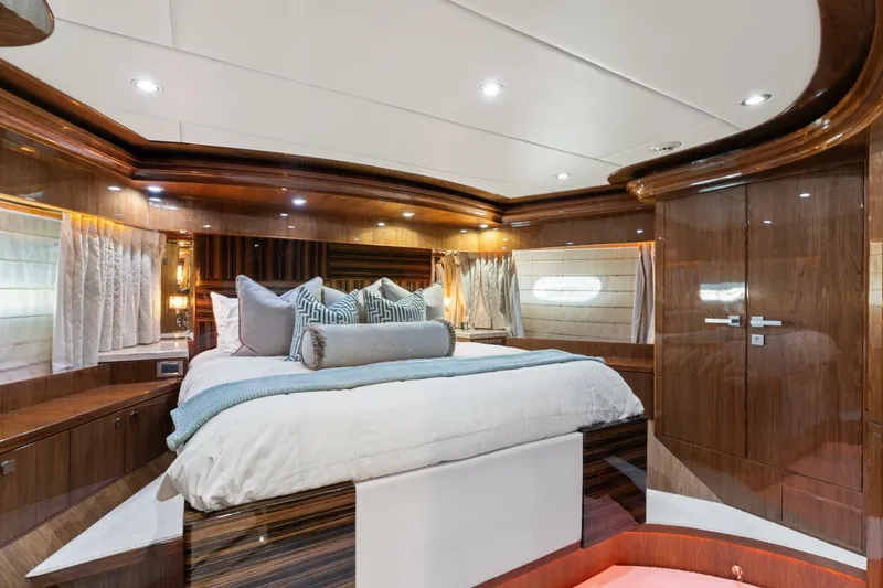 Slide: The Image of Luxurious bedroom interior of 2013 Hargrave 125 Raised Pilothouse yacht with elegant wood finishes. - 20