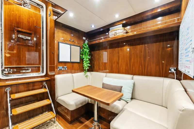 Slide: The Image of Luxurious interior of 2013 Hargrave 125 Raised Pilothouse yacht with elegant wood paneling. - 23