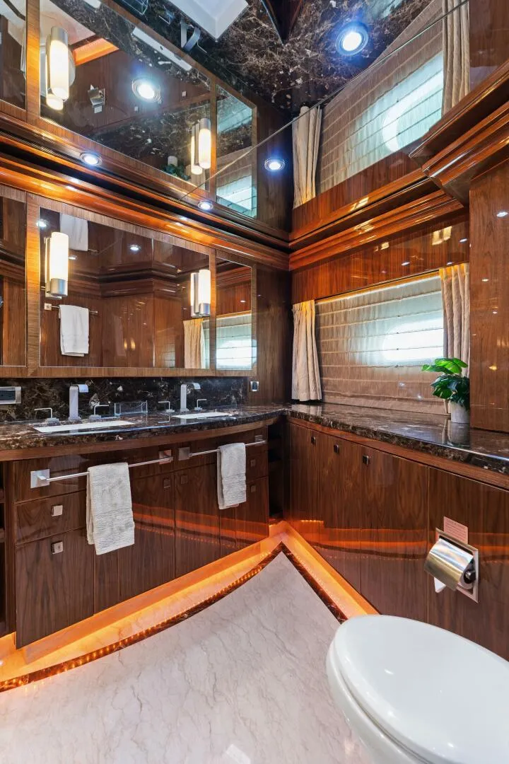 Slide: The Image of Luxurious bathroom in 2013 Hargrave 125 Raised Pilothouse yacht with elegant wood finishes. - 27