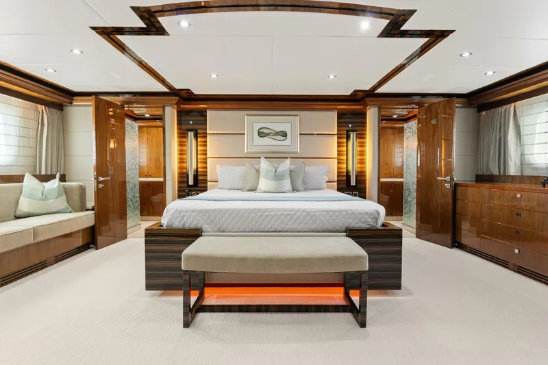 Slide: The Image of Luxurious bedroom interior of 2013 Hargrave 125 Raised Pilothouse yacht, featuring elegant wood finishes. - 32