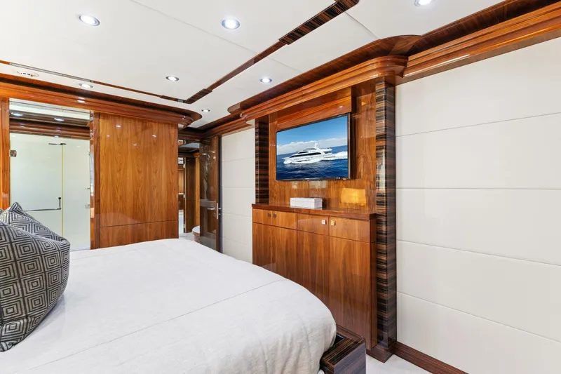 Slide: The Image of Luxurious bedroom interior of 2013 Hargrave 125 Raised Pilothouse yacht with wood paneling and TV. - 42