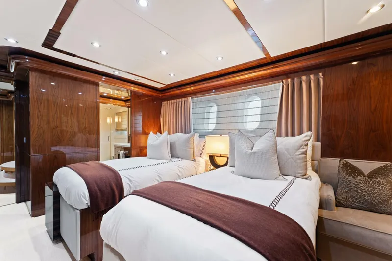 Slide: The Image of Luxurious twin bedroom on 2013 Hargrave 125 Raised Pilothouse yacht, featuring elegant wood finishes. - 45