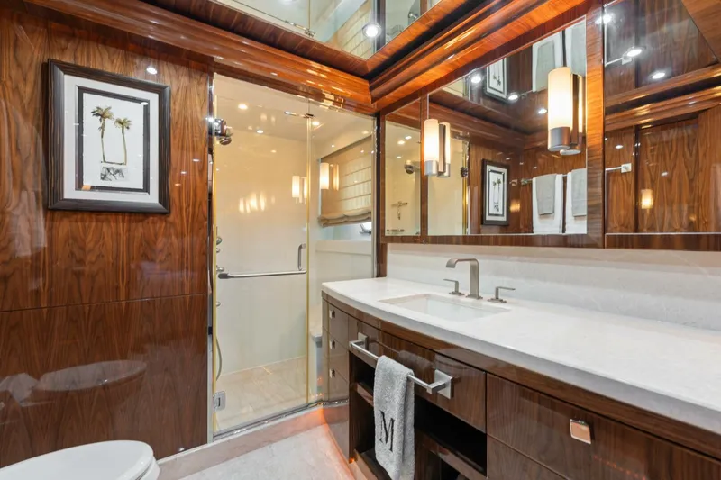 Slide: The Image of Luxurious bathroom in 2013 Hargrave 125 Raised Pilothouse yacht with elegant wood finishes. - 47
