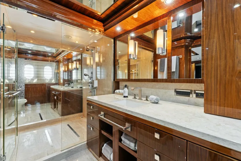 Slide: The Image of Luxurious bathroom in 2013 Hargrave 125 Raised Pilothouse yacht with elegant wood finishes. - 48