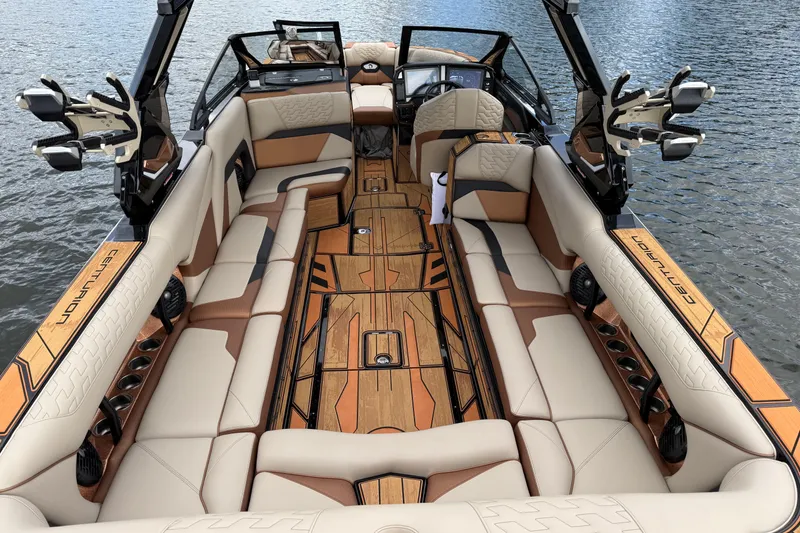 Slide: The Image of 2025 Centurion Ri265 boat interior with luxurious seating and modern design on the water. - 21