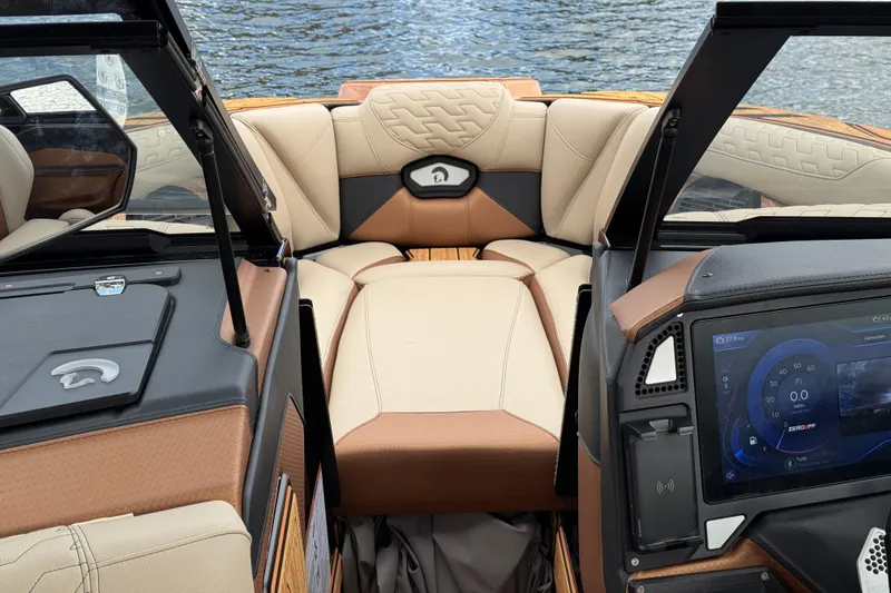 Slide: The Image of Interior of 2025 Centurion Ri265 boat with luxurious seating and modern dashboard. - 22