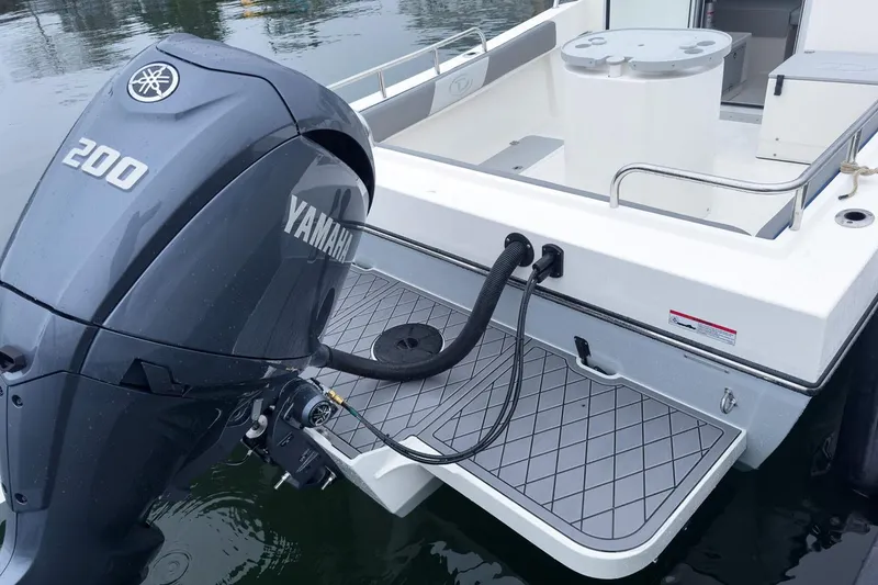Slide: The Image of Manufacturer Provided Image: 2025 Defiance Admiral 220 EX boat with Yamaha 200 outboard motor on water. - 5