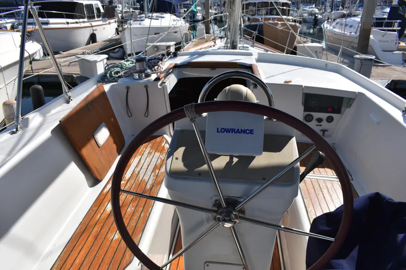 Slide: The Image of Cockpit of 2002 Beneteau Oceanis 42CC yacht with steering wheel and wooden deck. - 16