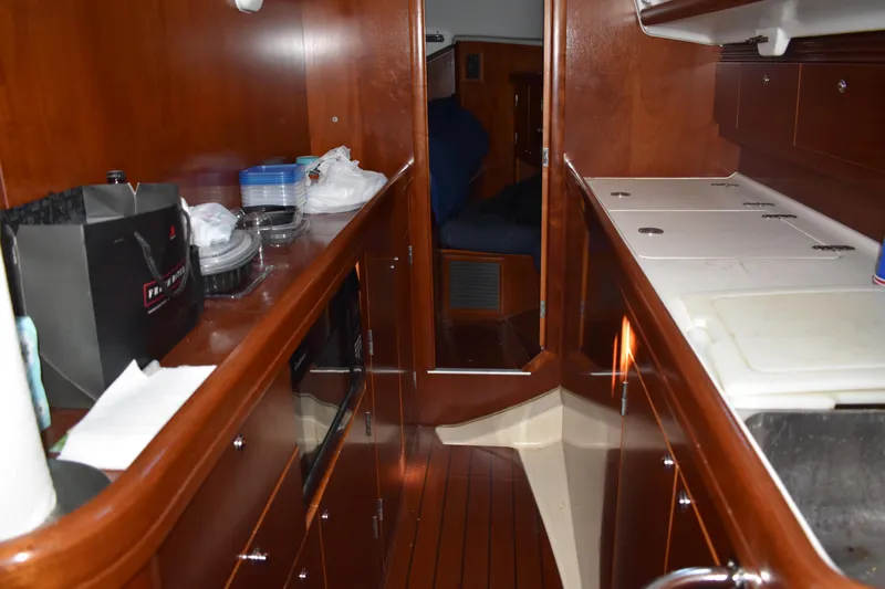 Slide: The Image of Interior of 2002 Beneteau Oceanis 42CC yacht with wooden finish. - 23