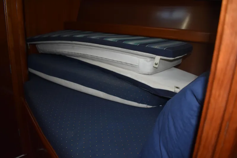 Slide: The Image of Interior of 2002 Beneteau Oceanis 42CC with blue cushions. - 25