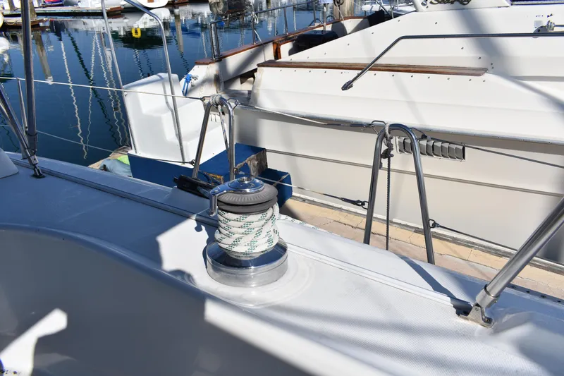 Slide: The Image of Beneteau Oceanis 42CC 2002, sailboat deck with winch in harbor. - 32