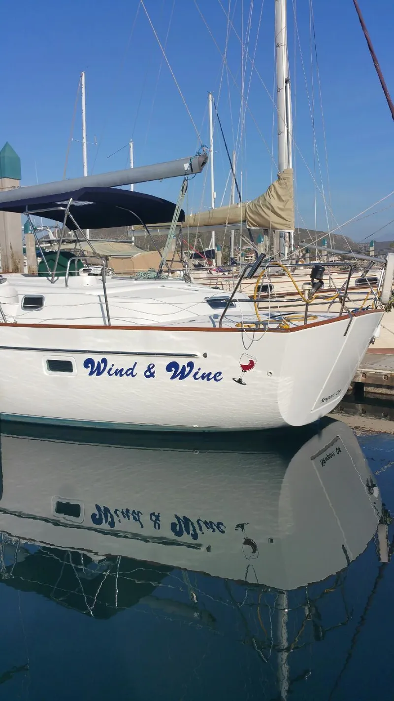 Slide: The Image of Beneteau Oceanis 42CC 2002 sailboat docked, named 'Wind & Wine'. - 4